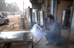A worker busy in making geyser at selawli road