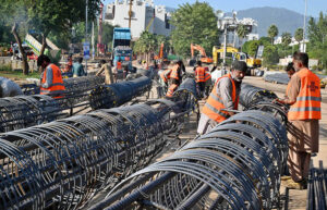 Laborers are busy binding steel at the construction site of an underpass along Khyaban-e-Suharwardi in the Federal Capital as part of ongoing development work.