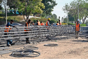 Laborers are busy binding steel at the construction site of an underpass along Khyaban-e-Suharwardi in the Federal Capital as part of ongoing development work.
