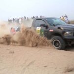 A racer showcases his skills in the final round of the 9th Thal Desert Jeep Rally organized by the Tourism Development Corporation of Punjab