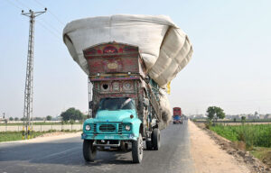 A fully loaded truck carrying dry fodder violates traffic laws, posing a potential hazard. Immediate attention from the concerned authorities is required to address this issue at new Hyderabad city road.