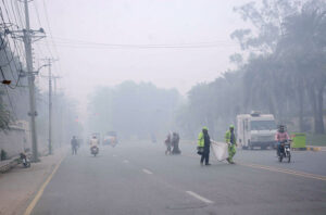 Thick smog blankets the city, reducing visibility and enveloping the surroundings.