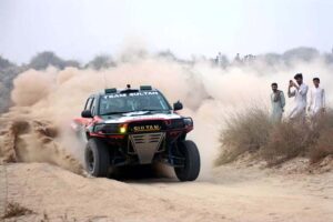 A racer showcases his skills in the final round of the 9th Thal Desert Jeep Rally organized by the Tourism Development Corporation of Punjab