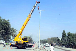 Heavy machinery is in use for construction work on Walton Road as part of development project in Lahore .