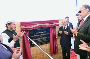 Prime Minister Muhammad Shehbaz Sharif unveils the plaque of inauguration of the Bubar Village Flood Rehab Project in District Ghizar.