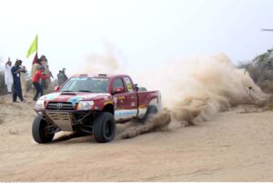 A racer showcases his skills in the final round of the 9th Thal Desert Jeep Rally organized by the Tourism Development Corporation of Punjab