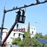 Worker busy repairing security cameras in Federal Capital