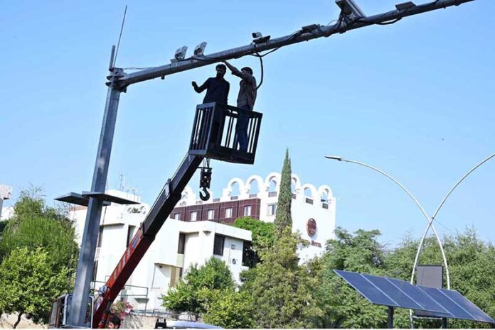 Worker busy repairing security cameras in Federal Capital