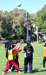 Players in action during a netball match between Government Girls High School and Piggott Girls High School at the 4th Hyderabad Students Olympic Games 2024, at Public School.