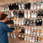 A vendor displaying used shoes to attract the customers near Jinnah Bagh Chowk