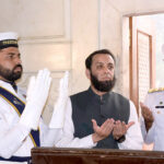 Federal Minister for Information and Broadcasting Attaullah Tarar offering Fateha after laying floral wreath during change of guard ceremony to pay homage to Allama Muhammad Iqbal on his 147 birth anniversary at Mazar-e-Iqbal