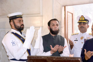 Federal Minister for Information and Broadcasting Attaullah Tarar offering Fateha after laying floral wreath during change of guard ceremony to pay homage to Allama Muhammad Iqbal on his 147 birth anniversary at Mazar-e-Iqbal