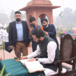 Federal Minister for Information and Broadcasting Attaullah Tarar records his remarks after offering Fateha and laying floral wreath at Mazar-e- Allama Muhammad Iqbal on his 147 birth anniversary