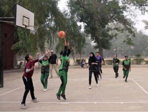Players in action during the intense basketball match between Govt Post Graduate College Chandni Chowk and Redor College Sargodha, part of the Intercollegiate Basketball Tournament organized by the Sargodha Education Board at Govt College Chandni Chowk