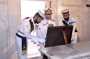 Commander Central Punjab of Pakistan Navy, Rear Admiral Azhar Mahmood lays floral wreath during change of guard ceremony to pay homage to Allama Muhammad Iqbal on his 147 birth anniversary at Mazar-e-Iqbal