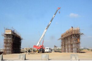 Construction work underway on an overhead bridge at Korangi River in provincial capital city.