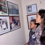 Visitor children looking at the displayed items used by Allama Iqbal on the occasion of Allama Iqbal's birthday