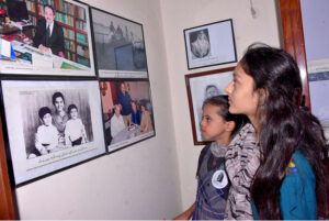 Visitor children looking at the displayed items used by Allama Iqbal on the occasion of Allama Iqbal's birthday