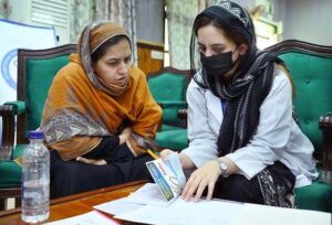 Diabetic doctors examine patients at a free diabetes medical camp for journalists and their families at the Press Club in Peshawar.
