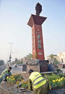 PHA staffer planting flowers at GPO Chowk.