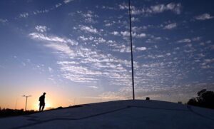 An attractive scene of dense clouds hovering in the sky casts a dramatic shadow that adds depth and mystery to the landscape in the federal capital