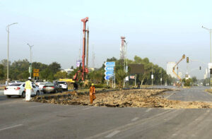 A development project is underway as heavy machinery is being used in the construction work at the PTCL Chowk Underpass, aimed at improving traffic flow and infrastructure in the heart of the Federal Capital.