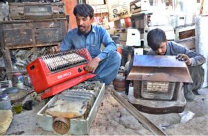 Workers busy repairing Faulty gas heaters at Surajganj Bazaar.
