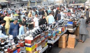 People purchasing used shoes at Sunday Saasta Bazar near Light House