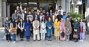 The students of Quaid-i-Azam University's Department of Defence & Strategic Studies in a group photograph with Managing Director APP Muhammad Asim Khichi, during their visit to the news agency's headquarters.