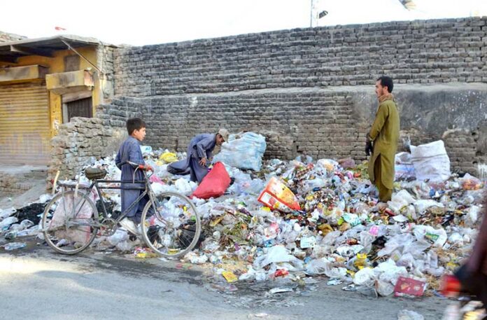 Children collecting trash from waste to run their livelihood