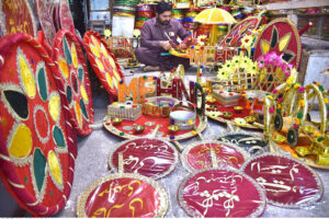 A vendor preparing the different kinds of decorated stuff mostly used to be in marriage ceremonies at their shop in the Provincial Capital.