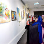Visitors watching the calligraphy artwork on the last day of exhibition organized by the Arts Council