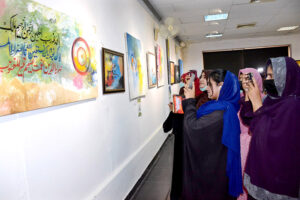 Visitors watching the calligraphy artwork on the last day of exhibition organized by the Arts Council