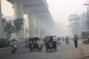 A view of vehicles navigating through the smog that is a serious health risk at Chowk Yateem Khana in the city.