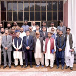 Managing Director Associated Press of Pakistan, Muhammad Asim Khichi and Vice Chancellor University of Sargodha Professor Dr. Qaiser Abbas in a group photo with the staffers after signing a Memorandum of Understanding (MoU) on behalf of their respective departments. The MoU aims at mutual collaboration including internships for university students at APP and holding joint training workshops