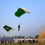 Paratroopers put on an impressive aerial performance during a horse and cattle show organized by the Directorate General of Sports Khyber Pakhtunkhwa at Col Sher Khan Stadium