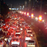 People on their way back to home stuck in traffic congestion at Shara-e-Faisal