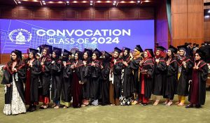 Students celebrate in the traditional way by throwing caps in the air after Convocation 2024 at Capital University of Science and Technology (CUST)