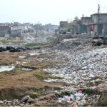 A view of garbage spreading along nullah at Pindorian Bridge is creating environmental problems and needs the attention of the concerned authorities