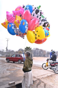 Vendor Displays plastic Balloons to attract customers at Khanna pul