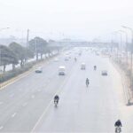 Vehicles on the way at Expressway during foggy weather in Federal Capital
