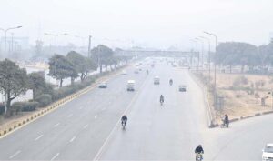 Vehicles on the way at Expressway during foggy weather in Federal Capital