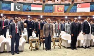 Prime Minister Muhammad Shehbaz Sharif standing in respect of national anthem at the inaugural session of the Commonwealth Asia Youth Alliance summit.