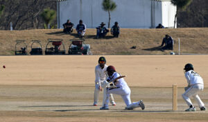 West Indies batter Mikyle Louis prepares for a powerful shot in response to Pakistan's strong bowling during the first Test match at Islamabad Club in federal capital.