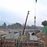 Labourers busy in construction work of Serena Chowk Interchange Project during development work in the Federal Capital