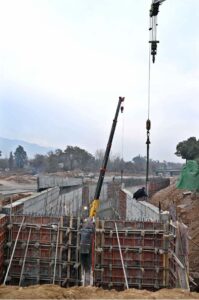 Labourers busy in construction work of Serena Chowk Interchange Project during development work in the Federal Capital