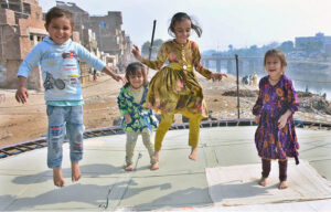 Young girls enjoying the swing at Ghumanabad area.
