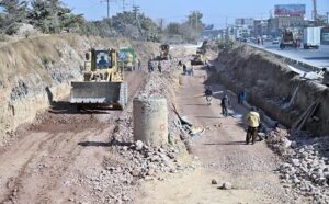 Labourers busy in their work at the site of under construction 10th Avenue during development work in Federal Capital.