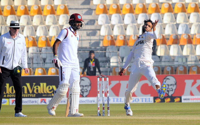 Pakistan's Kashif Ali bowls during the first day of the second Test cricket match between Pakistan and West Indies at the Multan Cricket Stadium