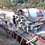 Labourers busy construction work of protection wall along IJP Service Road in the Federal Capital